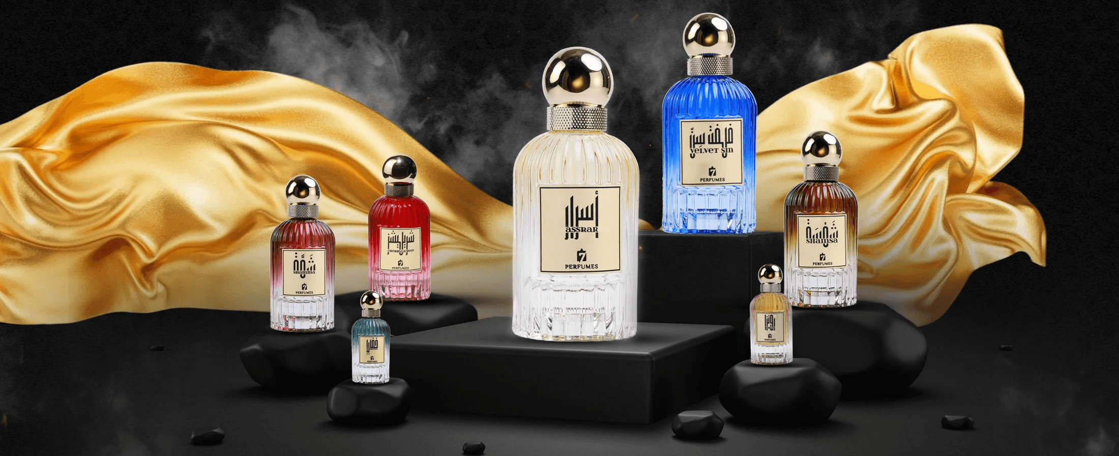 7Perfumes bottles on black pedestals against draped gold fabric